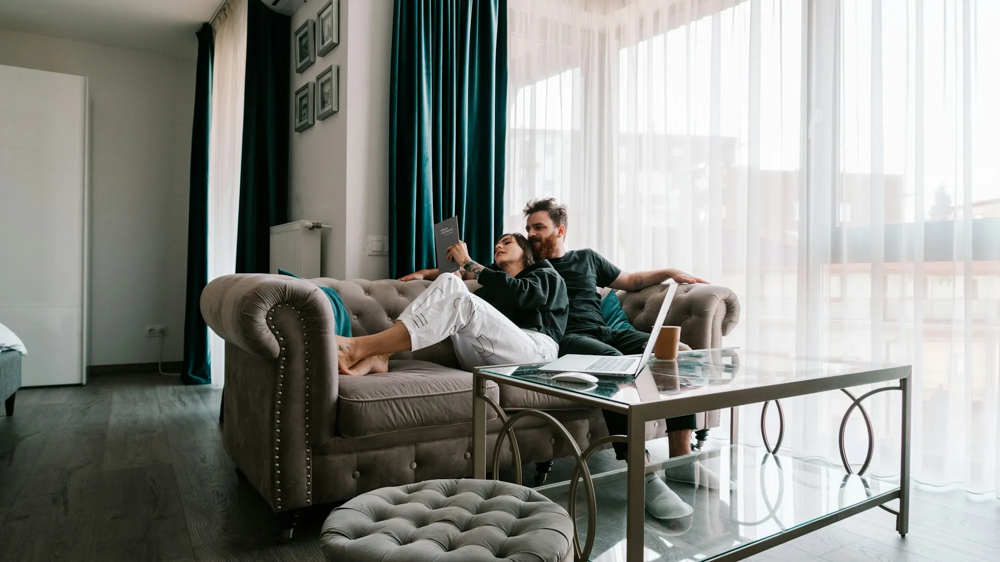 Couple relaxing on a sofa in a bright living room